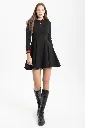 vestido-punto-negro-evase (2).webp